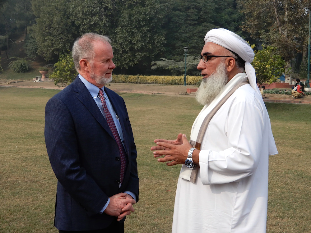 J.P. Knight in conversation with an imam
